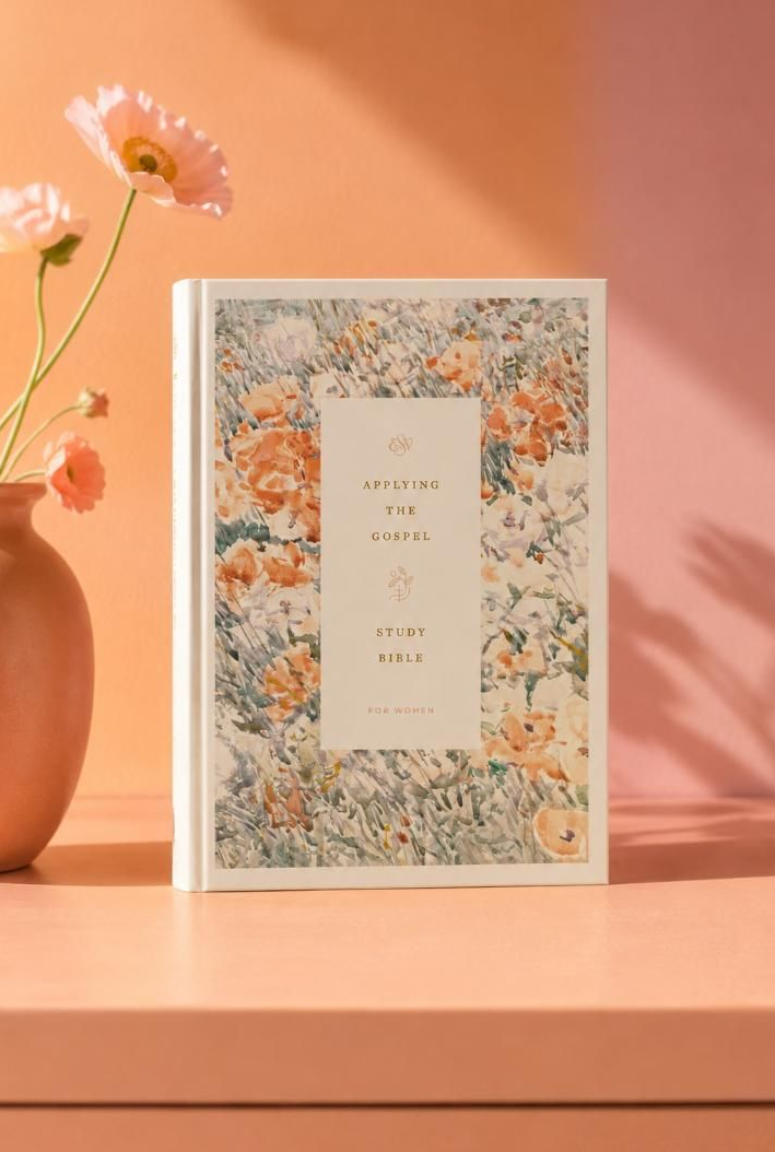 Minimal floral greeting card on a peach table beside a terracotta vase and flower stem