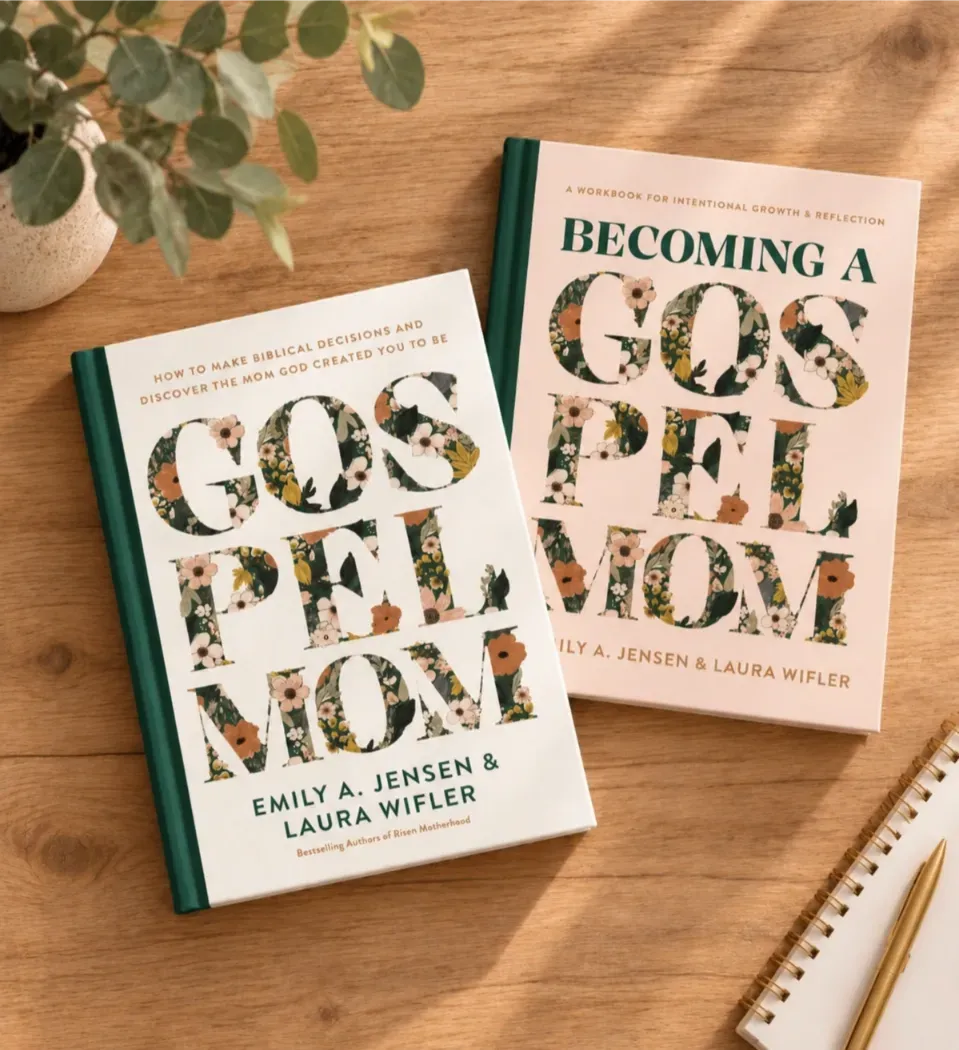 Two gospel-themed books on a wooden desk beside a spiral notebook and pencil