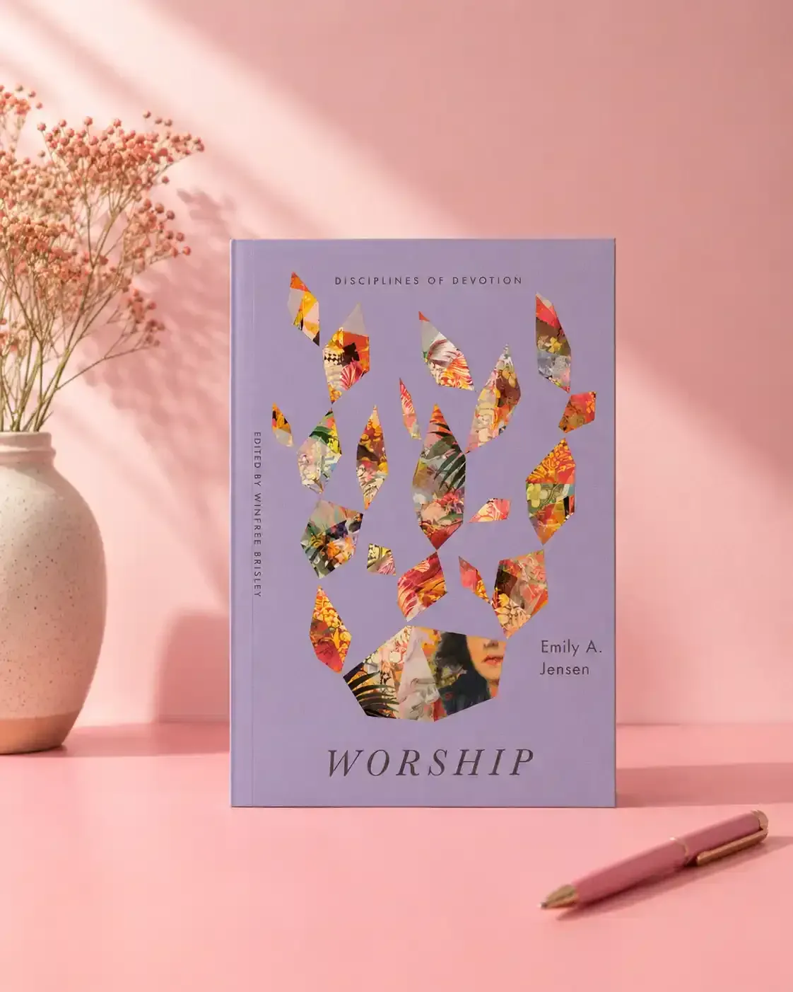 Lavender worship card with colorful leaf collage on a pink tabletop, beside a vase and pencil