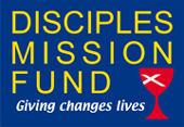 A blue sign that says disciples mission fund giving changes lives