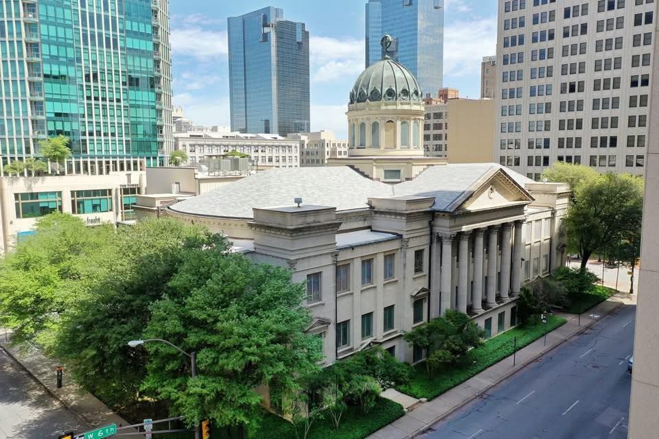 An aerial view of a large building in a city