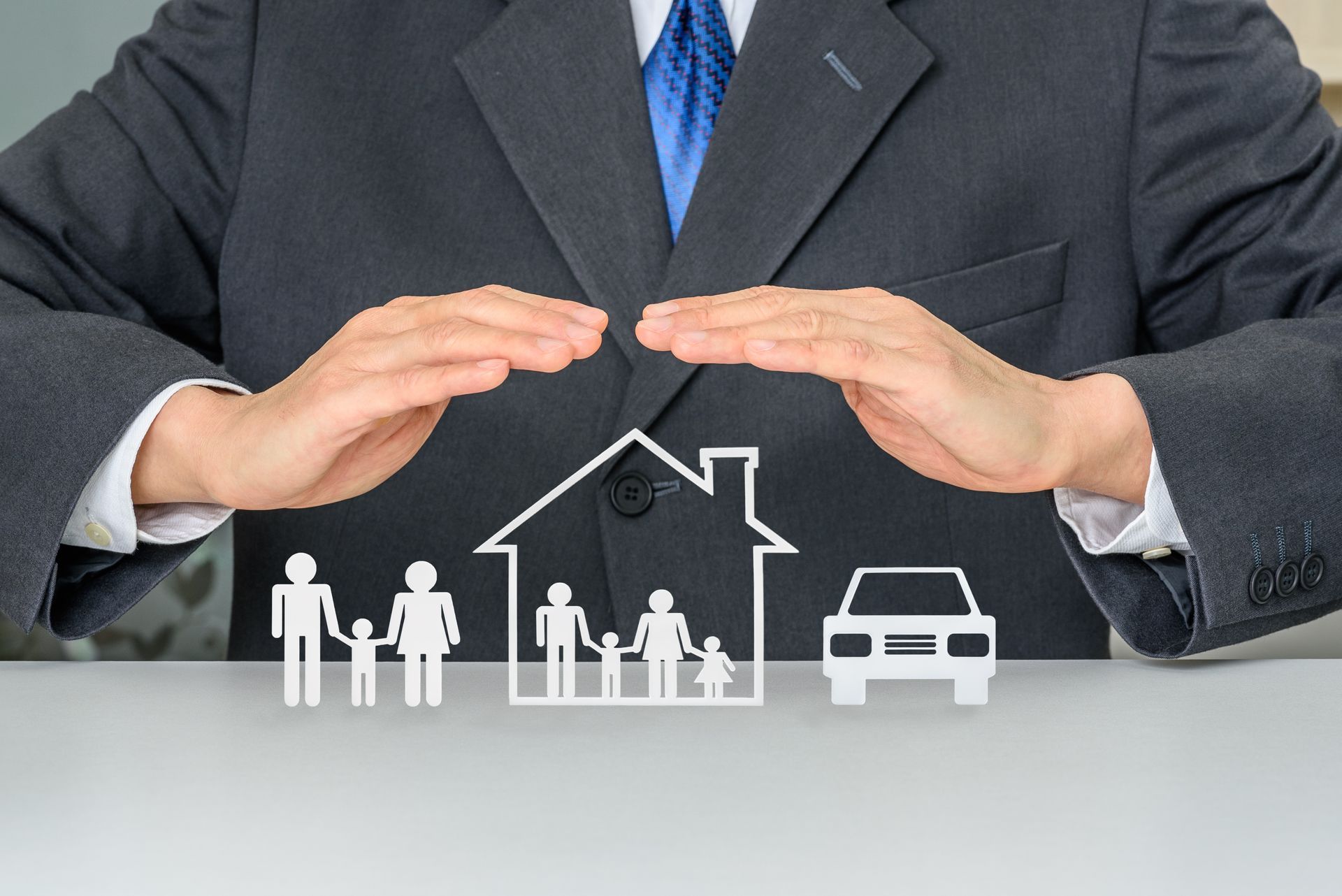 Hands Protect Paper Cutouts of a Family — Precision Financial & Tax In Ross Creek, VIC