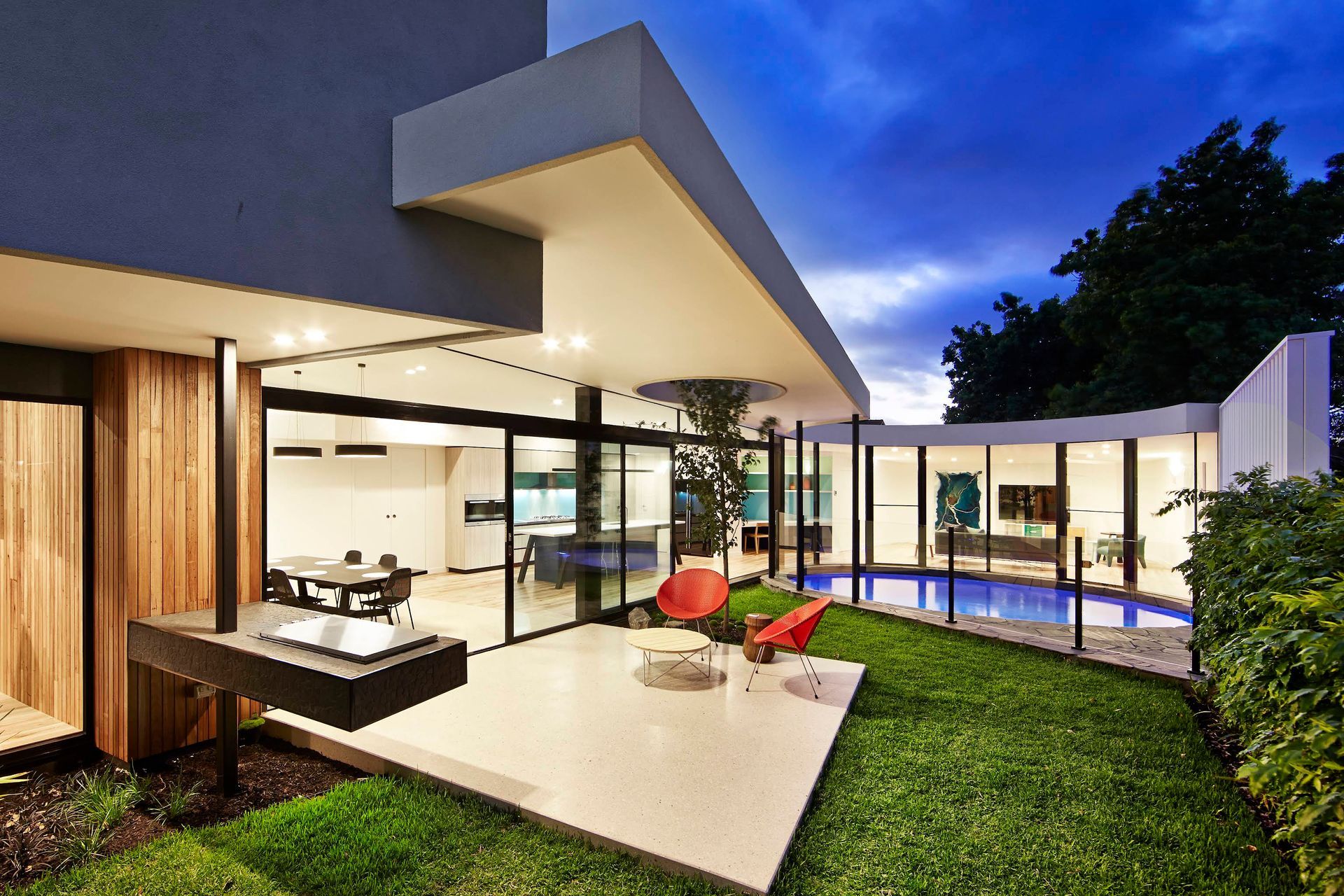 Modern Luxury Home Patio With Pool, Glass Walls and Landscaped Lawn — KM Custom Homes In Mount Eliza, VIC
