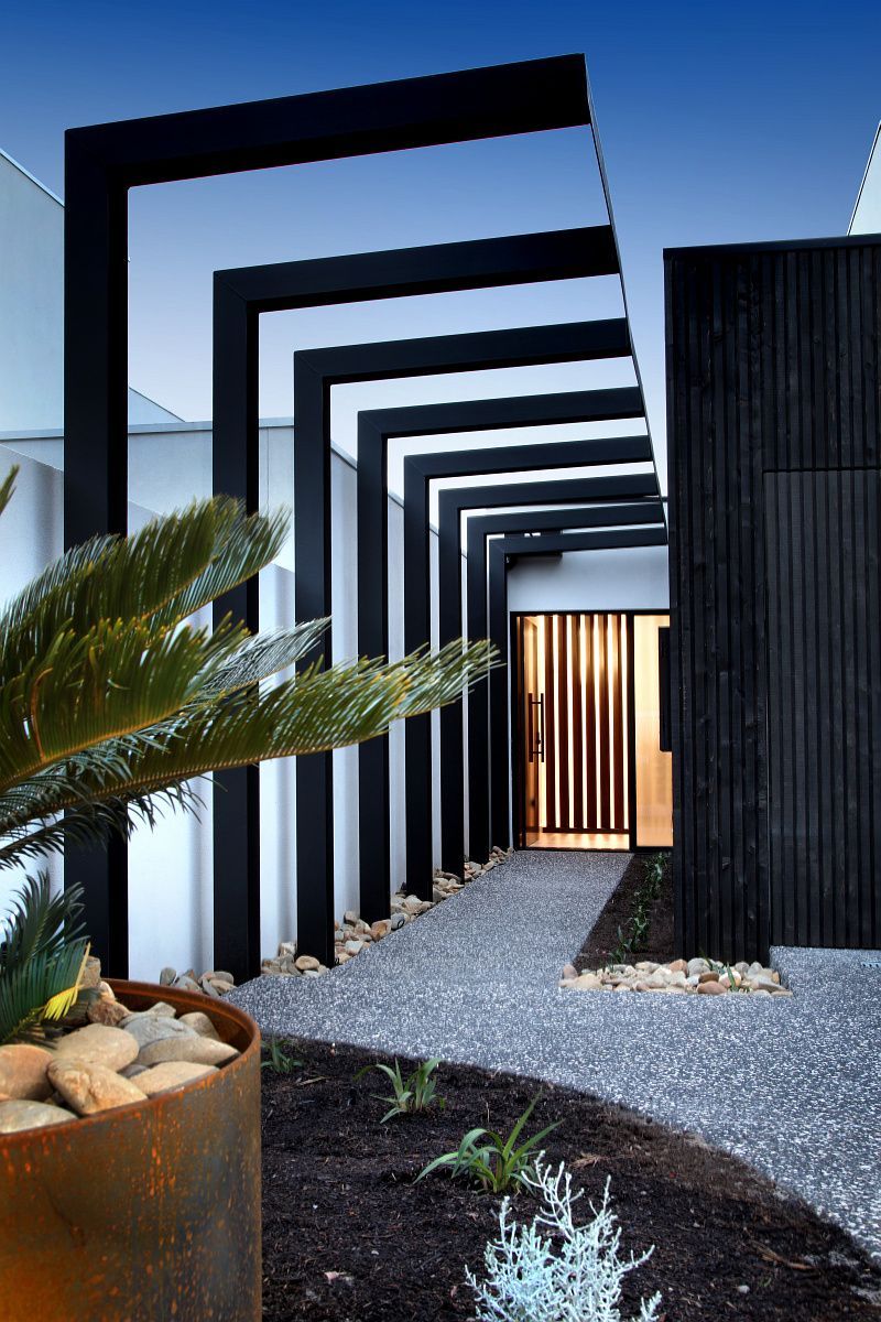 A Living Room With A Blue Couch , Chairs And A Table — KM Custom Homes In Mount Eliza, VIC