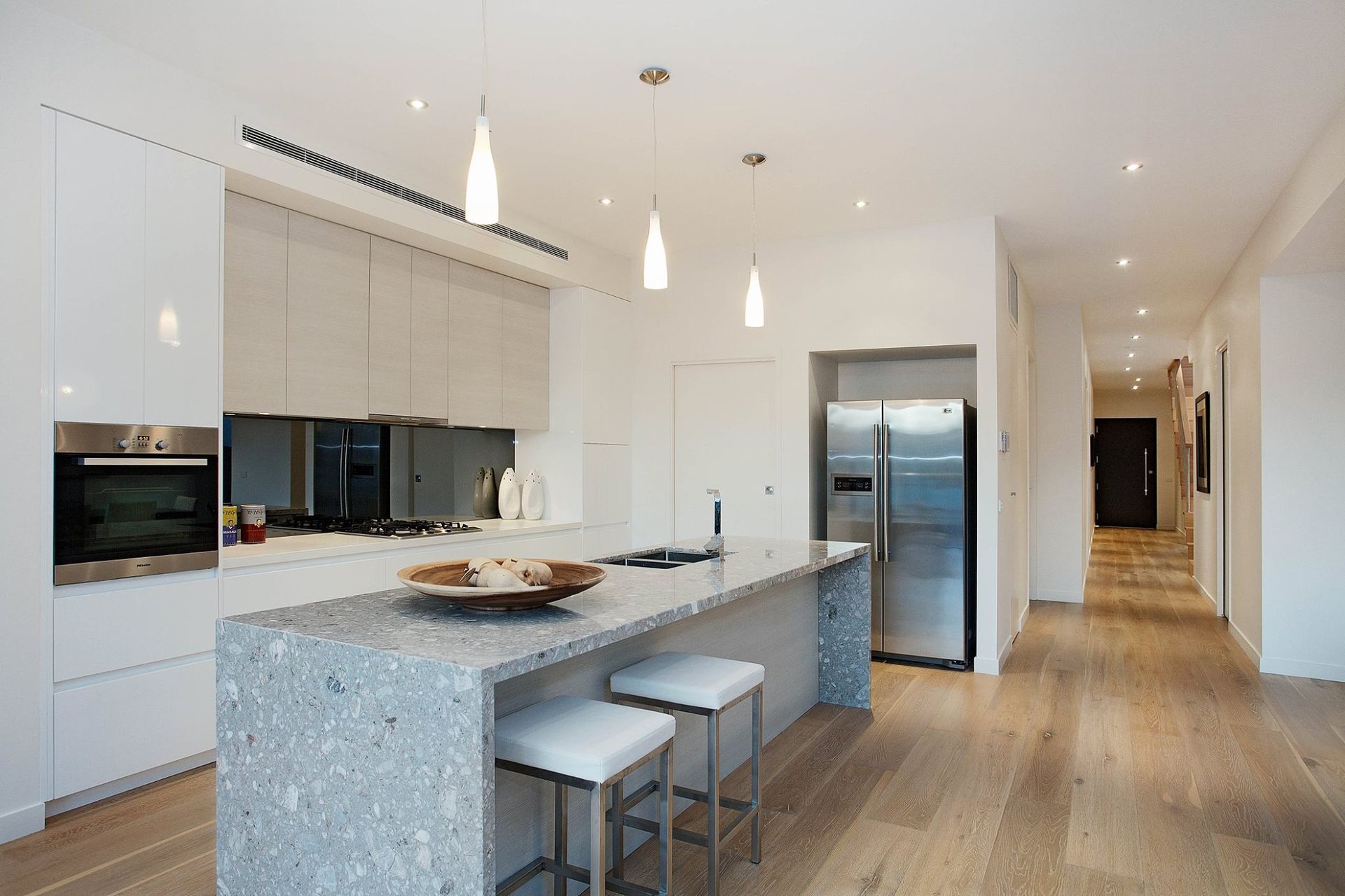 Modern White Kitchen With Large Island And Pendant Lights — KM Custom Homes In Mornington, VIC