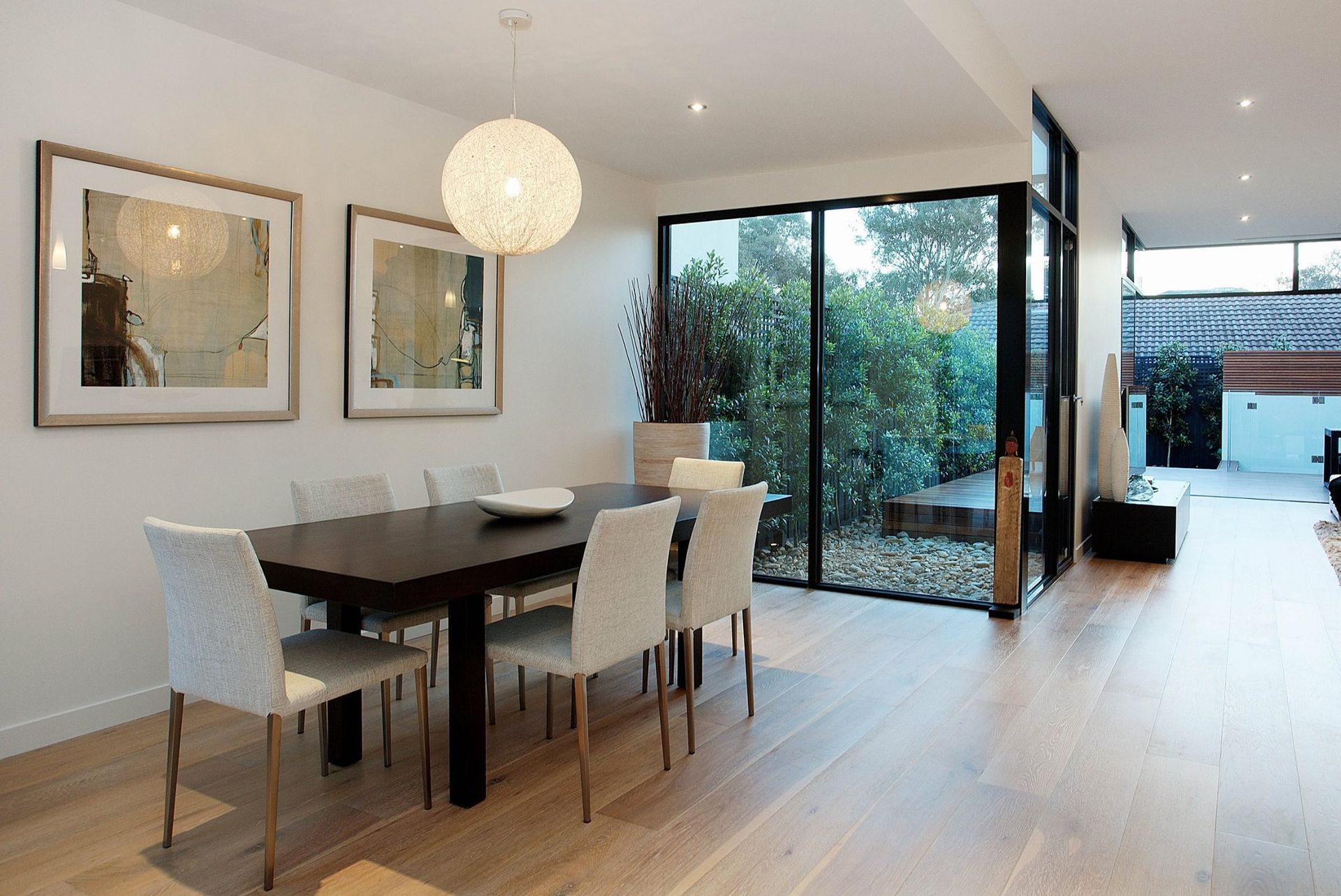 Modern Dining Room With Dark Table And White Chairs — KM Custom Homes In Mount Martha, VIC