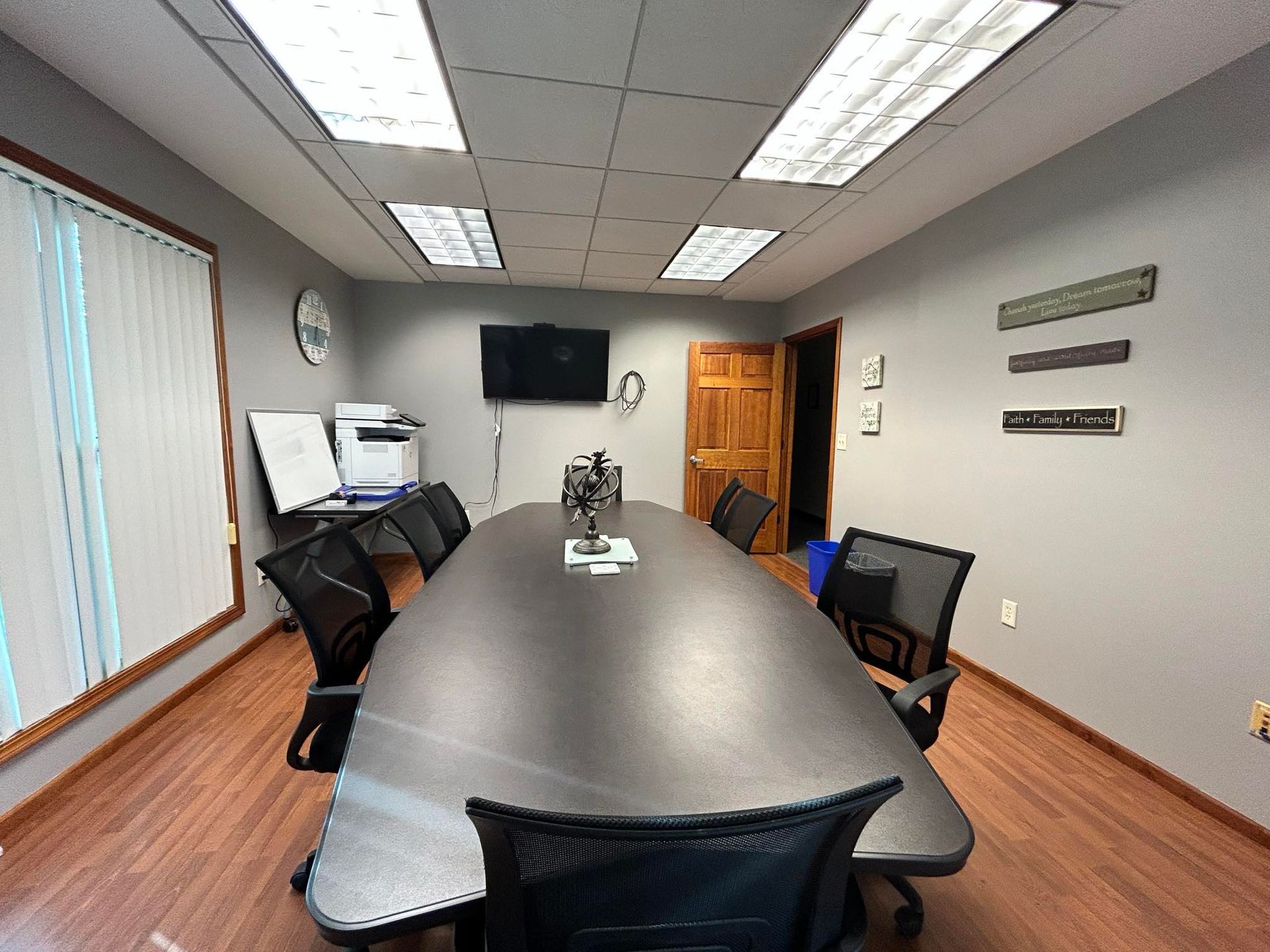 A conference room with a long table and chairs
