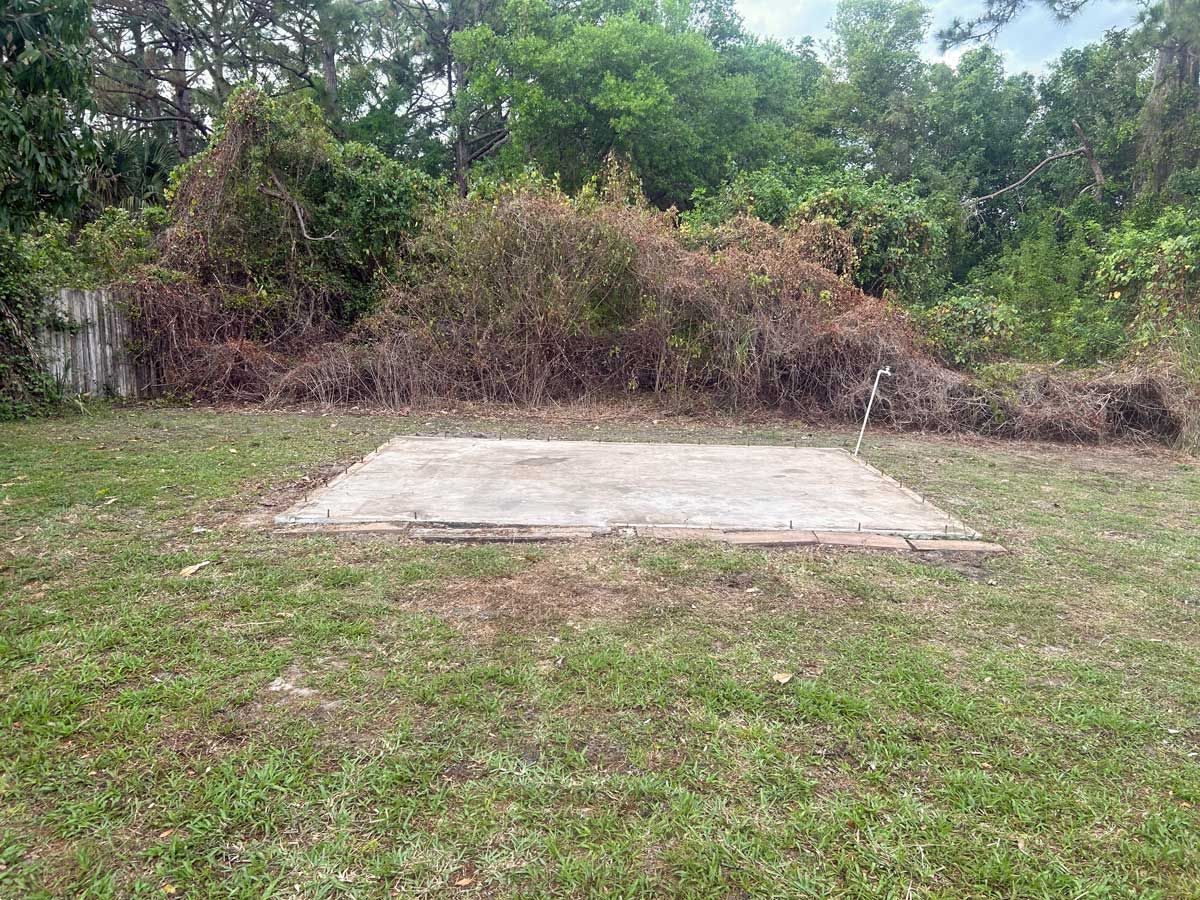 An empty foundation after the old shed had been removed.