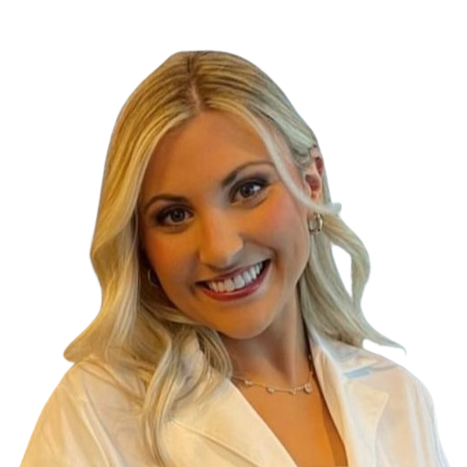 Coursey Pitts Puliam, with blonde hair smiling, wearing a white coat and necklace.
