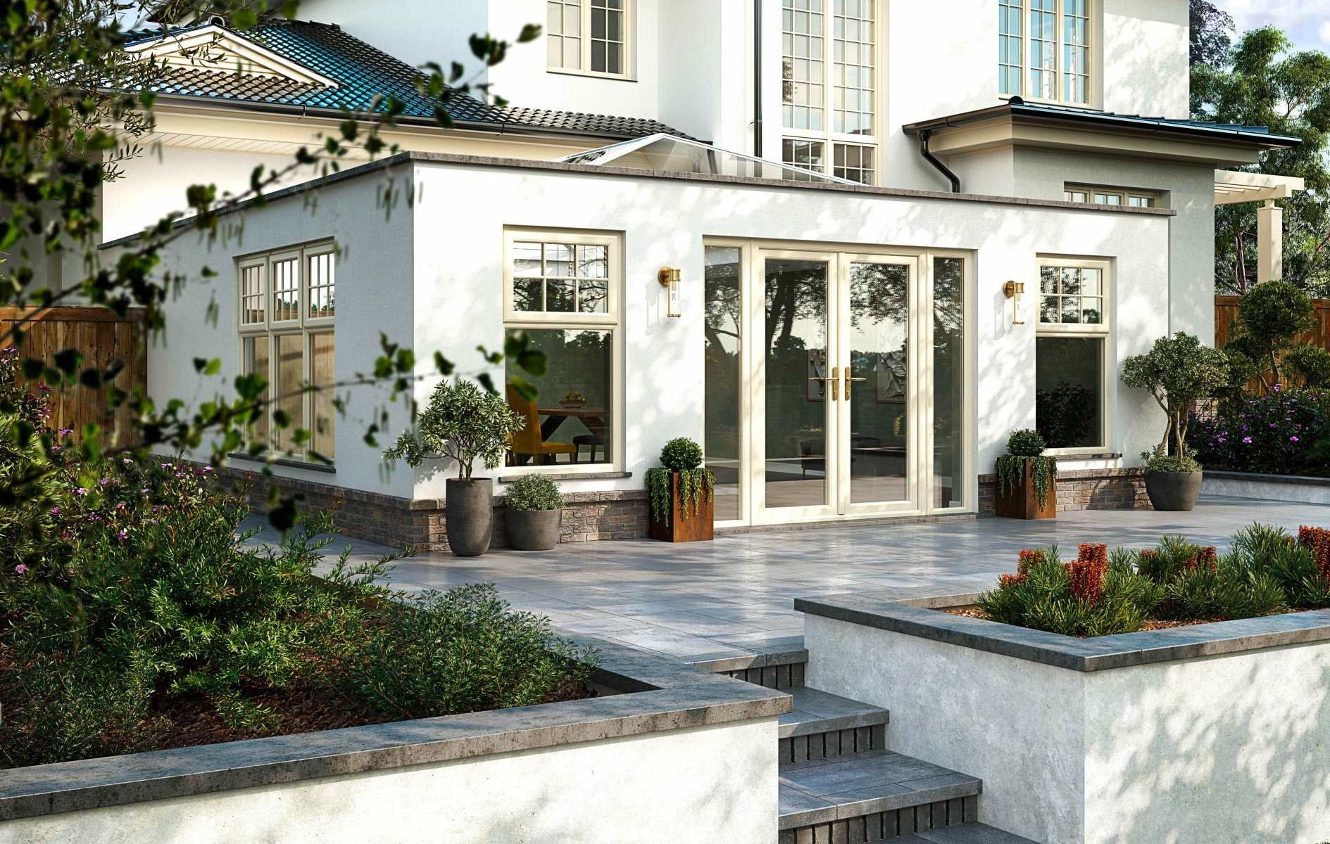 Back patio with white stucco walls, French doors, and landscaping.