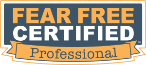 Fear Free Certified Professional badge in orange, white, and blue on a ribbon design