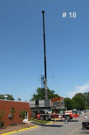 Lifting the Refrigerator — Detroit, MI — Astro Heating & Cooling Inc.
