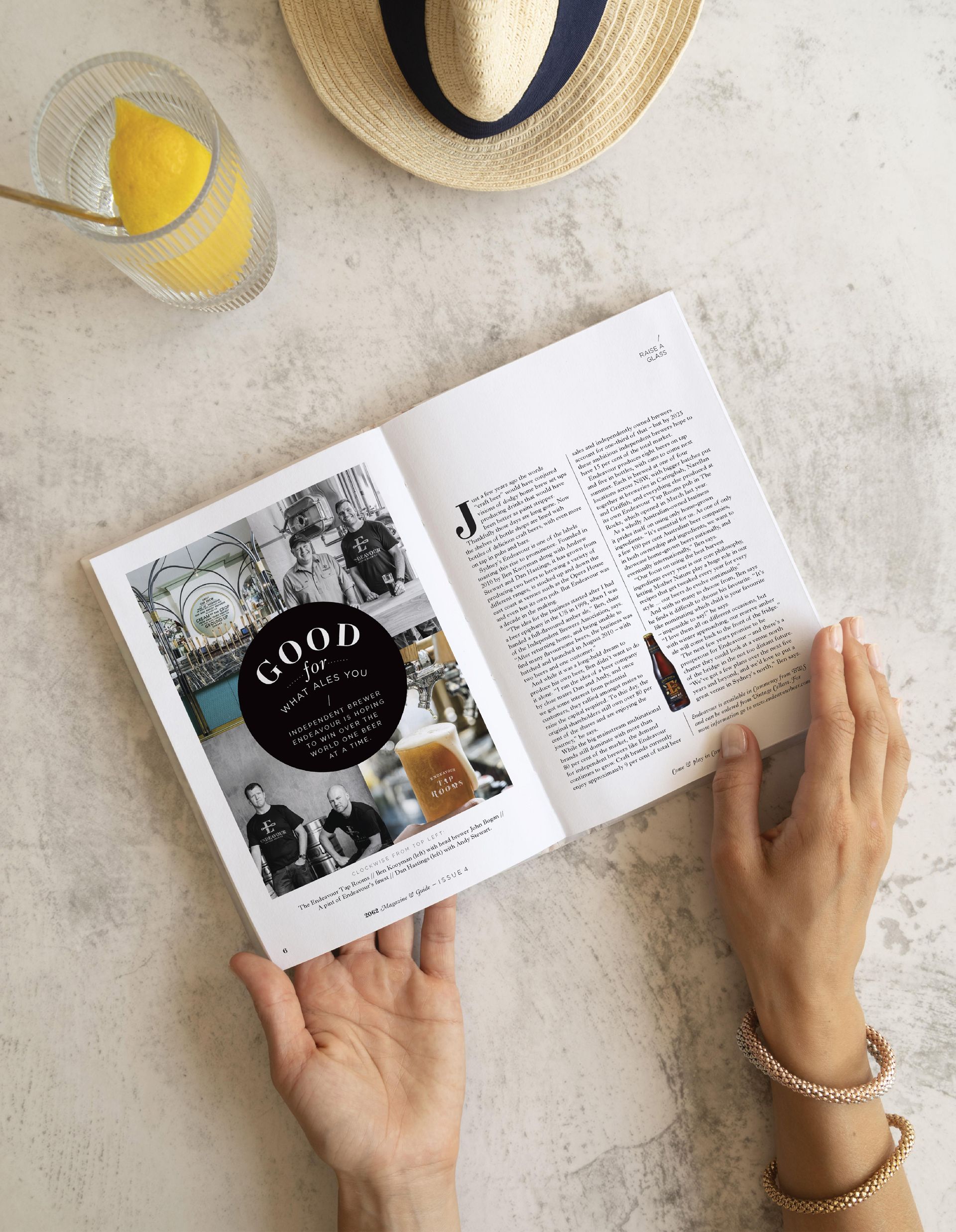 A person holding open the 2062 Magazine featuring a spread about independent brewers in Cammeray, designed by The End Creative Agency in Sydney