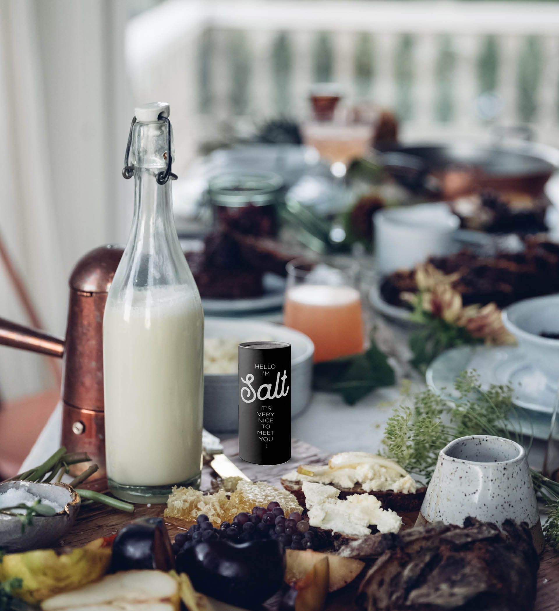 Universal Restaurant salt shaker shown in a dining setting, designed by The End Creative Agency.