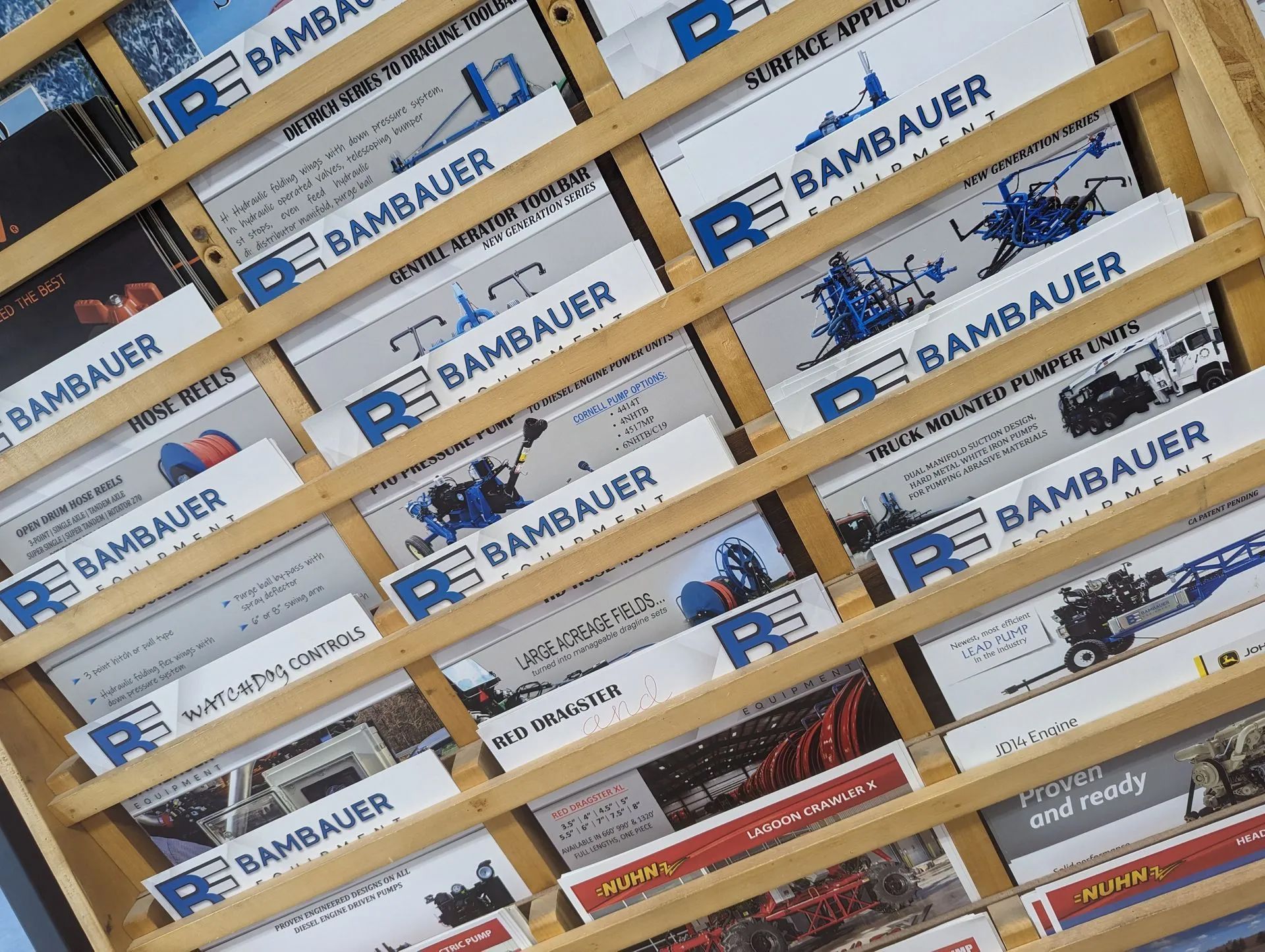 Stacked Bambauer-branded cardboard boxes on warehouse shelves.