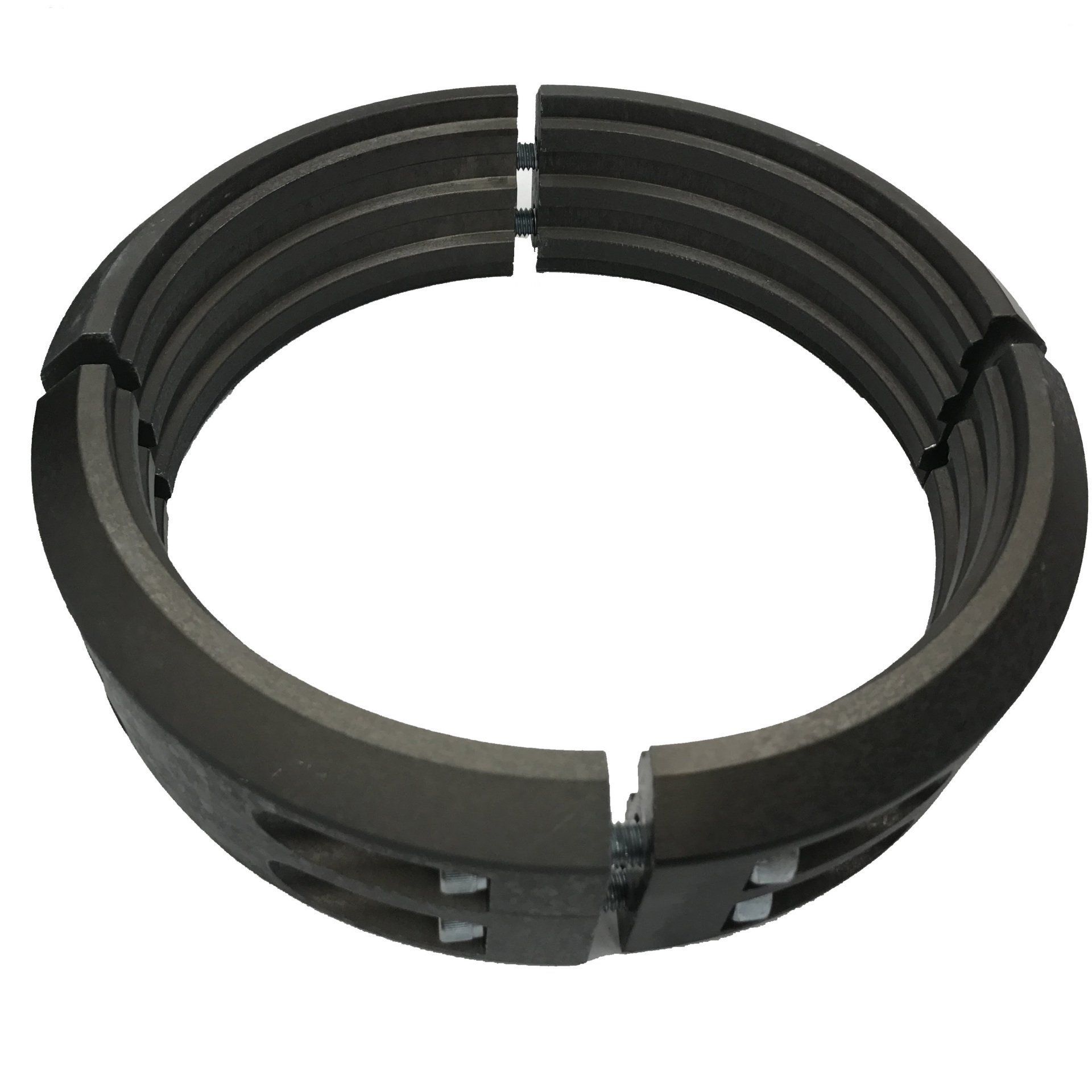 Black metal piston ring set arranged in a circle on a white background