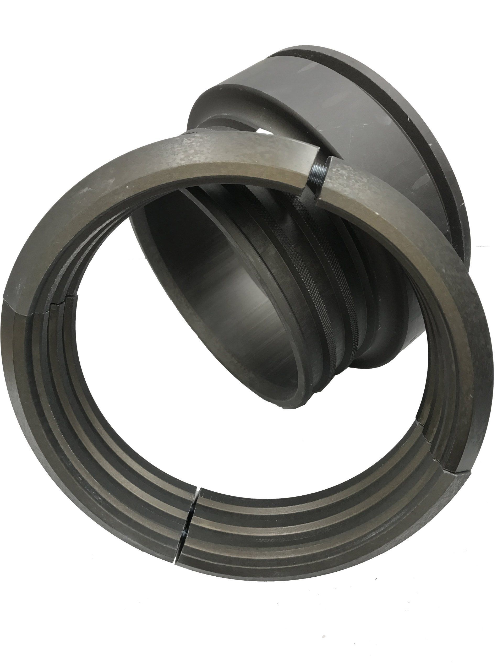 Close-up of a black corrugated plastic pipe fitting with a flanged end