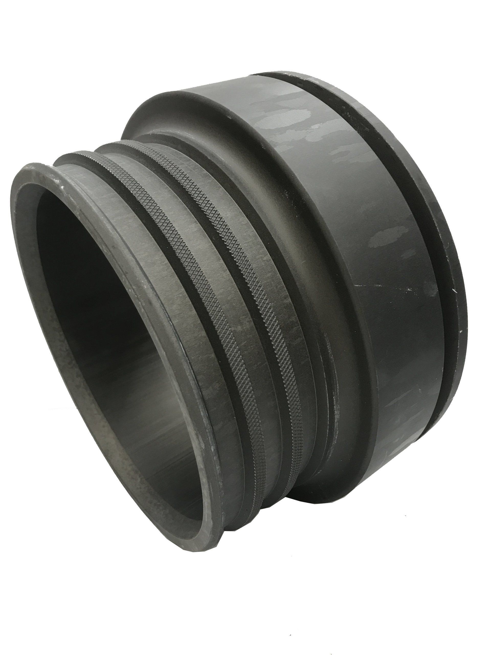 Black rubber pipe coupling with ribbed center and smooth ends, isolated on white background