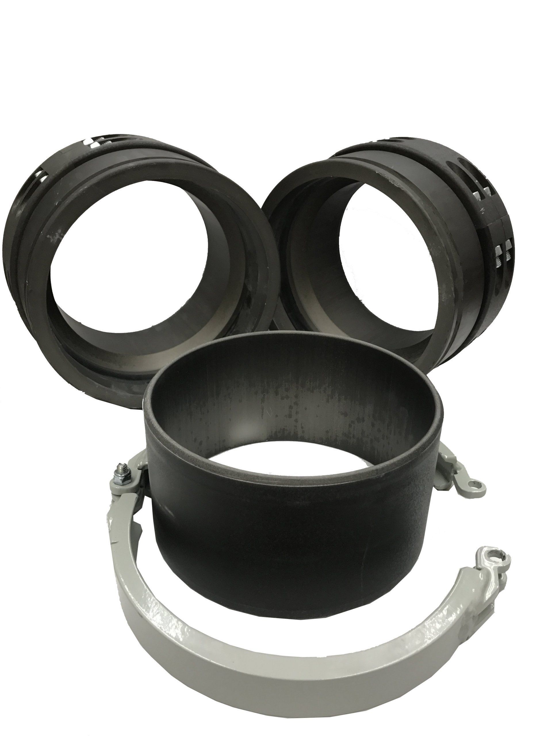 Black and silver pipe couplings and clamps arranged on a white background