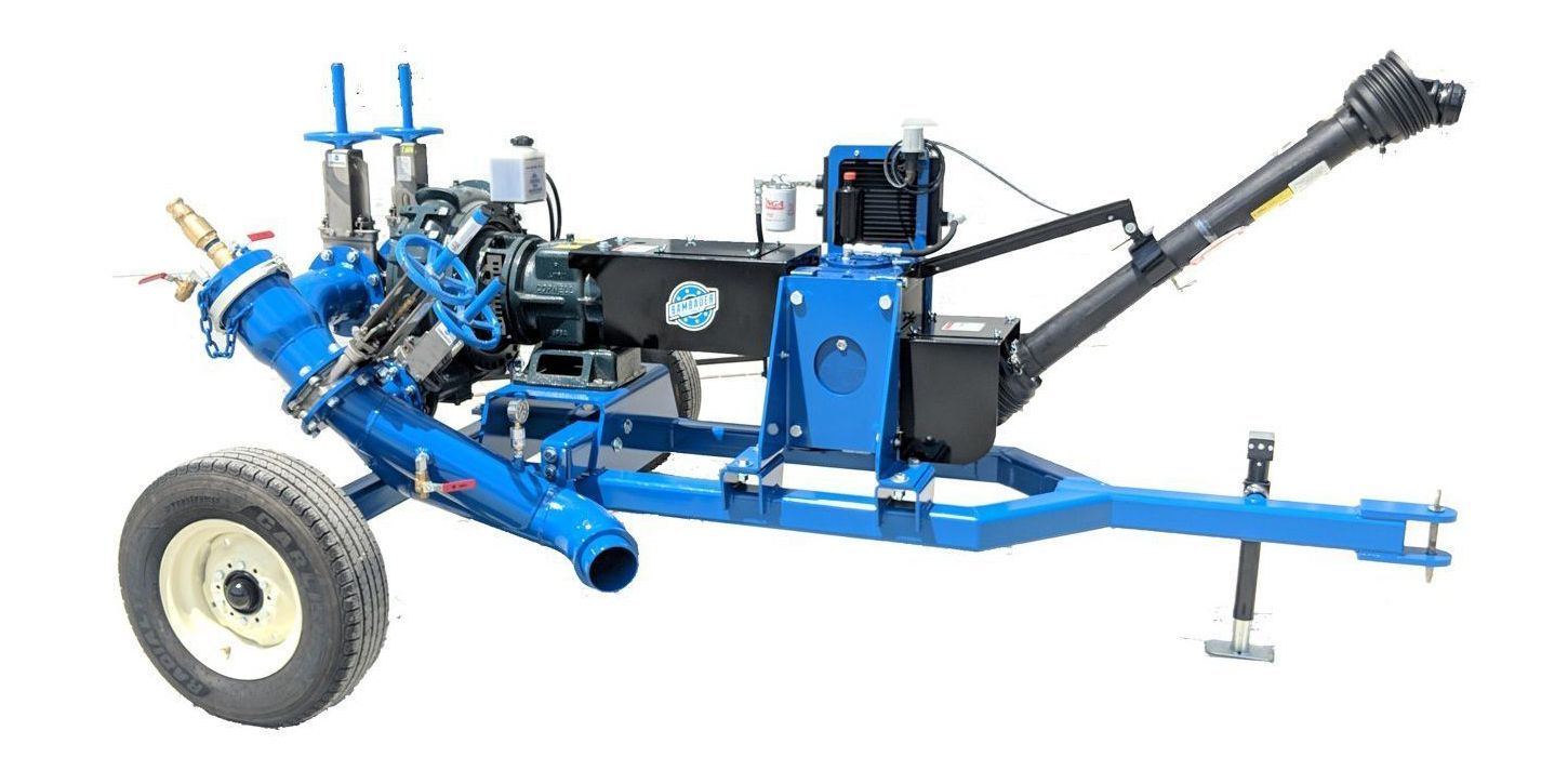 Blue agricultural machine trailer with large wheels and hitch on a white background