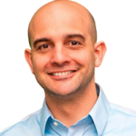 Smiling bald man in a light blue shirt on a white background