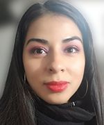 Close-up portrait of a person with dark hair, pink eye makeup, and red lipstick against a soft gray background