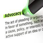 Close-up of the word “Advocacy” in green text on a page with a definition below.