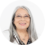 Smiling woman with long gray hair and glasses on a white background
