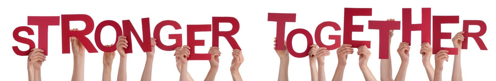 Hands holding red letters spelling “STRONGER TOGETHER” on a white background