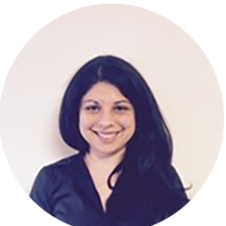 Smiling woman with long dark hair in a black shirt against a light circular background