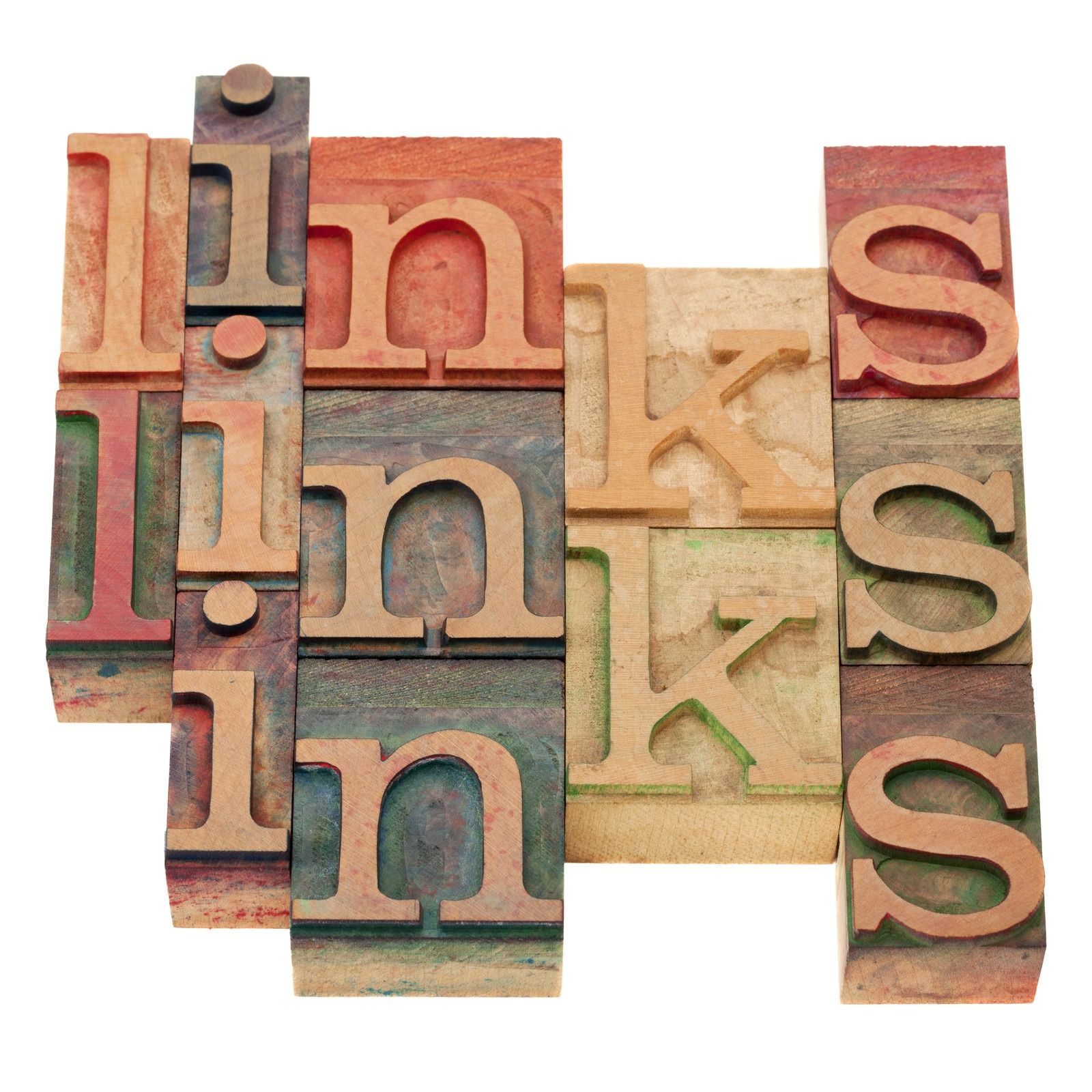 Stacked colorful letterpress blocks spelling “link” and “s” on a white background