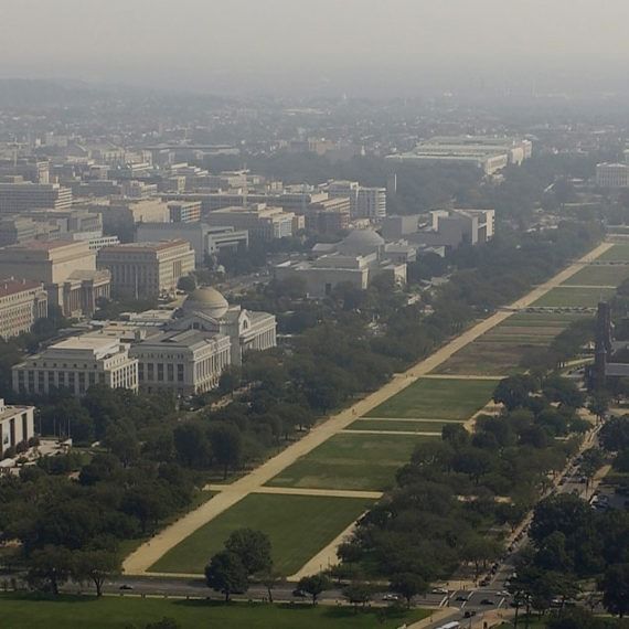 Aerial view of the National Mall in Washington, D.C., with the Lincoln Memorial and the Washington Monument visible.