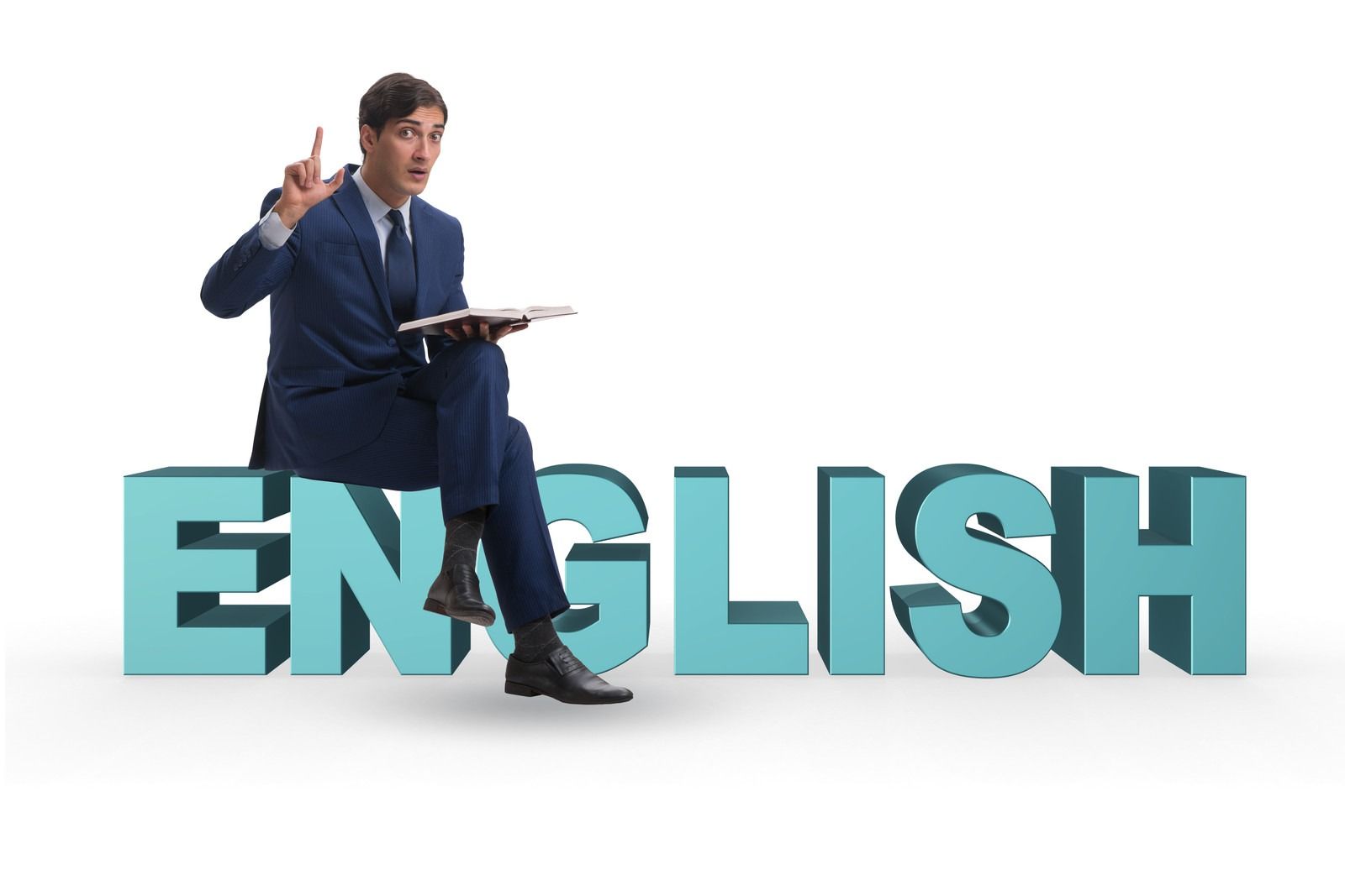 Man in a suit sitting on large blue “ENGLISH” letters, holding a notebook and raising one finger.