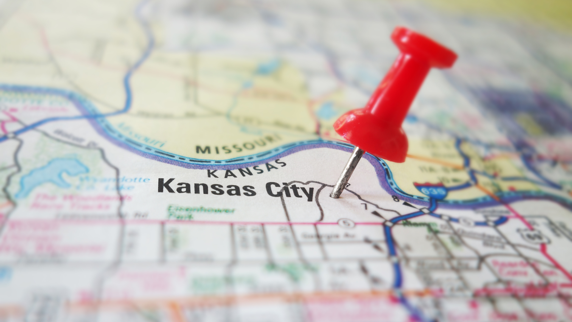 A red pin is pinned to a map of kansas city.