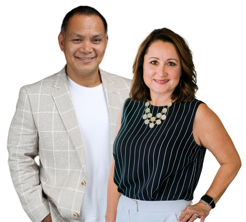 Two smiling adults posing against a white background, one in a light blazer and one in a black striped top.