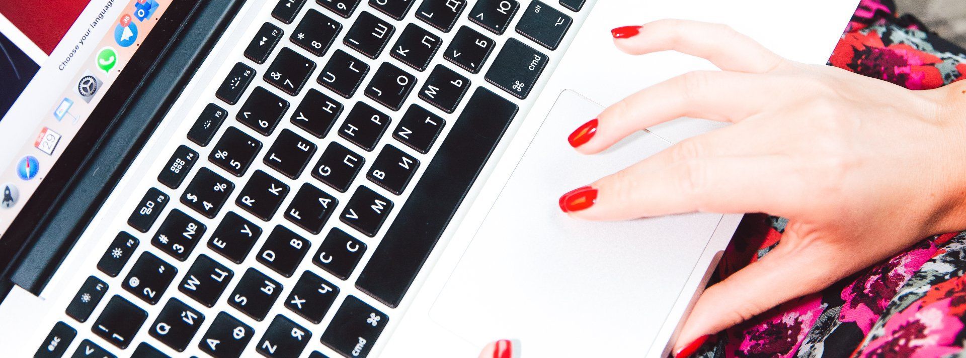 image of a hand on a computer keyboard