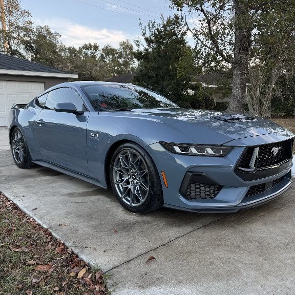 Before and after image of clean blue mustang