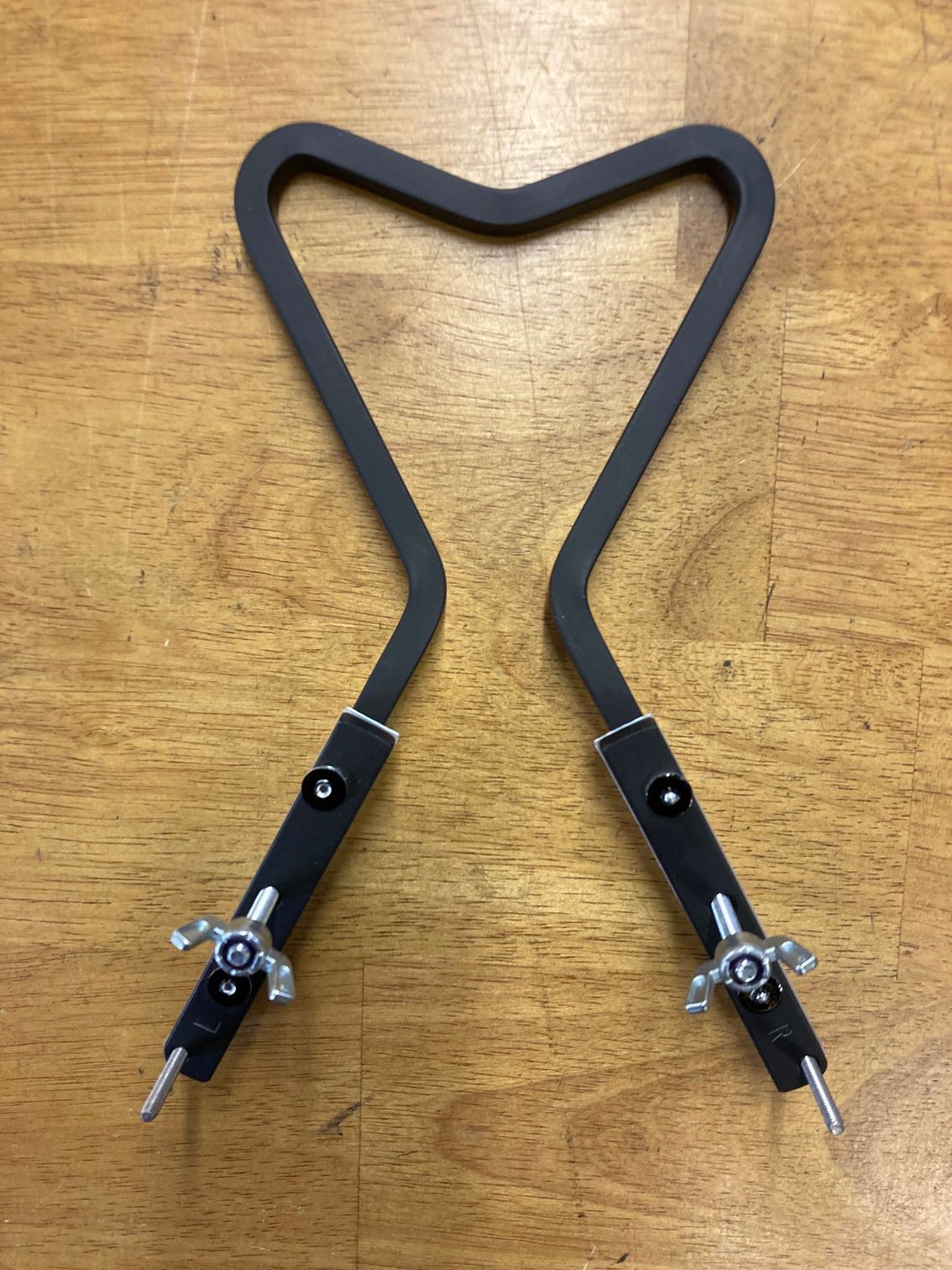 A pair of scissors sitting on top of a wooden table.