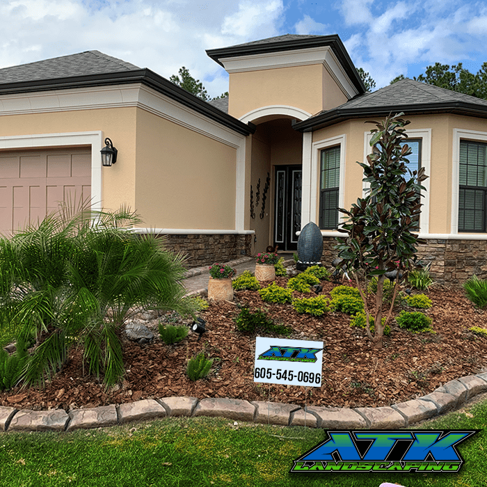 A house with a sign in front of it that says atk on it.