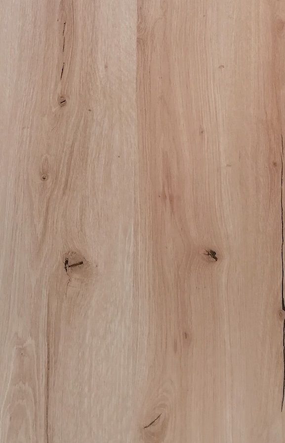 A close up of a piece of wood showing the grain and texture.