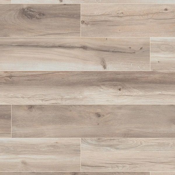 A close up of a tile floor that looks like wood.
