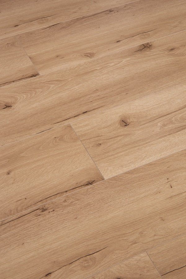 A close up of a wooden floor in a room.