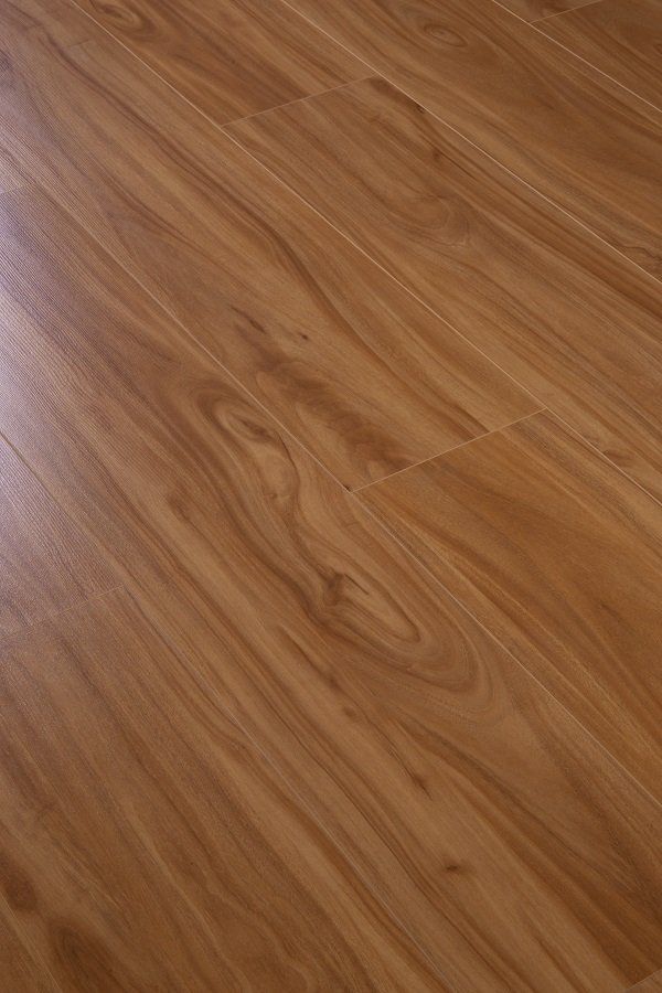 A close up of a wooden floor in a room.