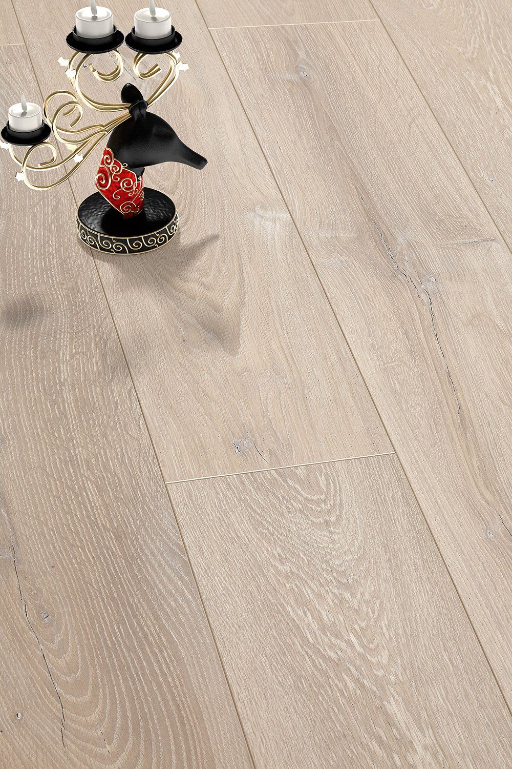 A candle holder with candles on it is on a wooden floor.