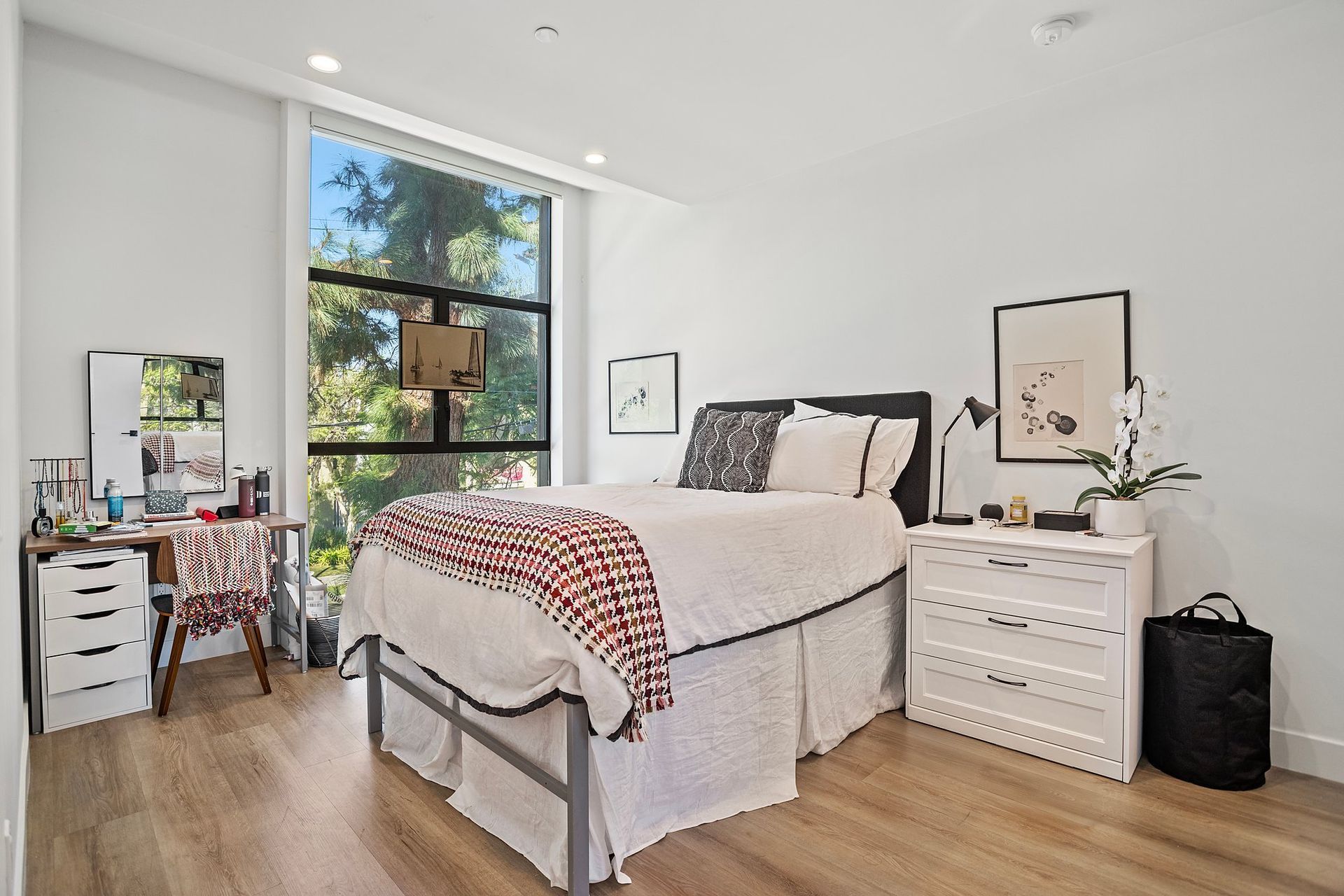 Furnished bedroom at Oasis at the Row apartments near USC