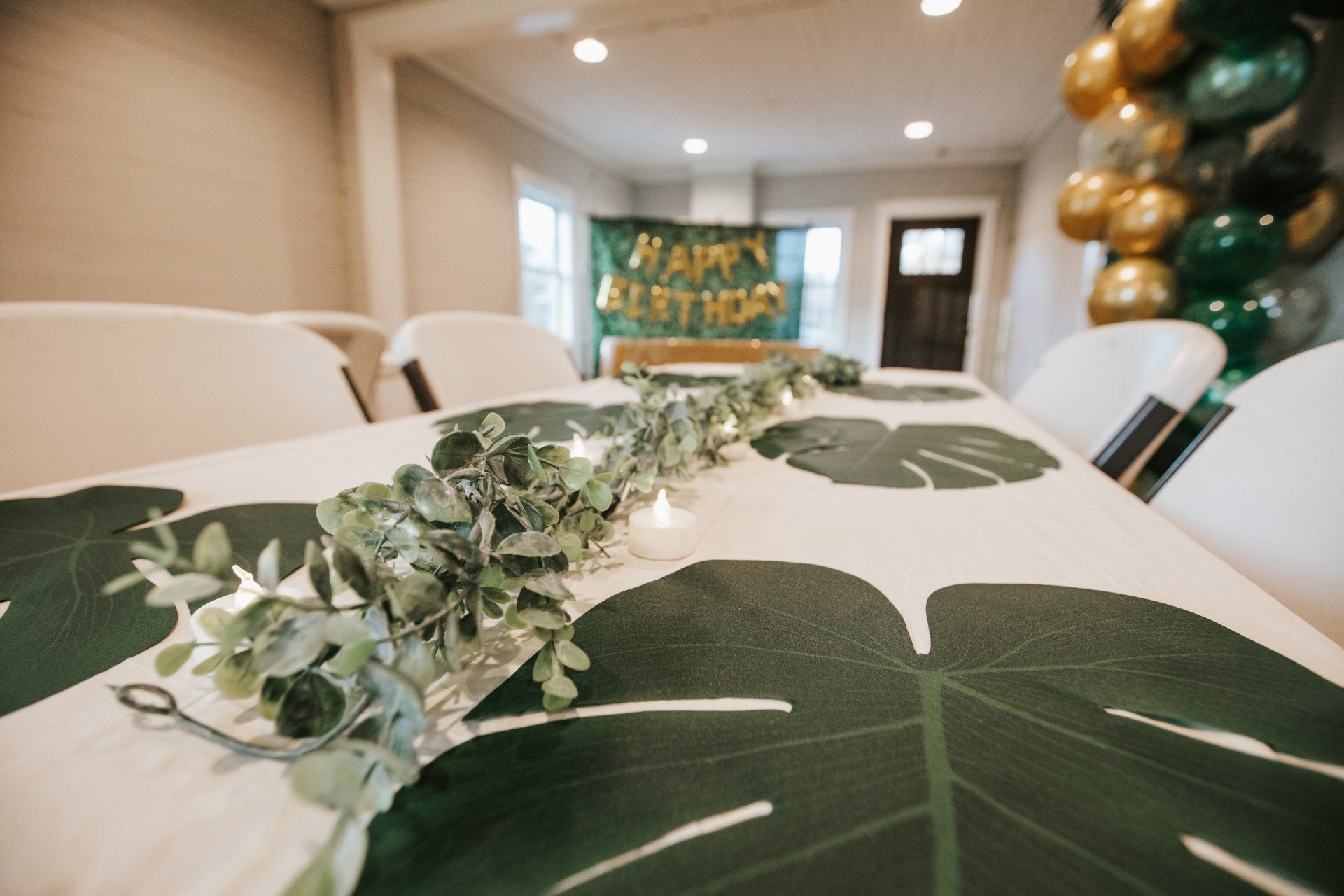 A table with a table cloth that looks like a palm tree leaf.