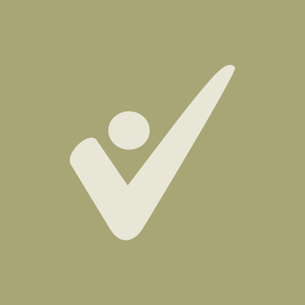 A white check mark with a circle in the middle on a green background.