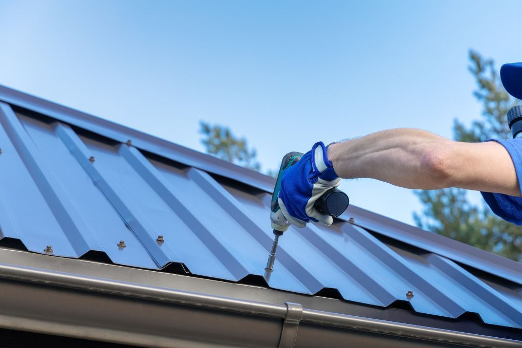 Roofers Kilmarnock repairing a commerical metal roof