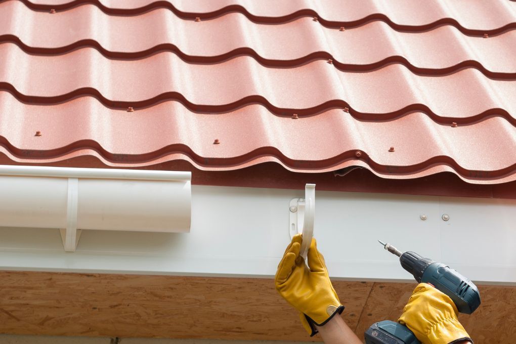 Roofers Kilmarnock installing new gutter brackets