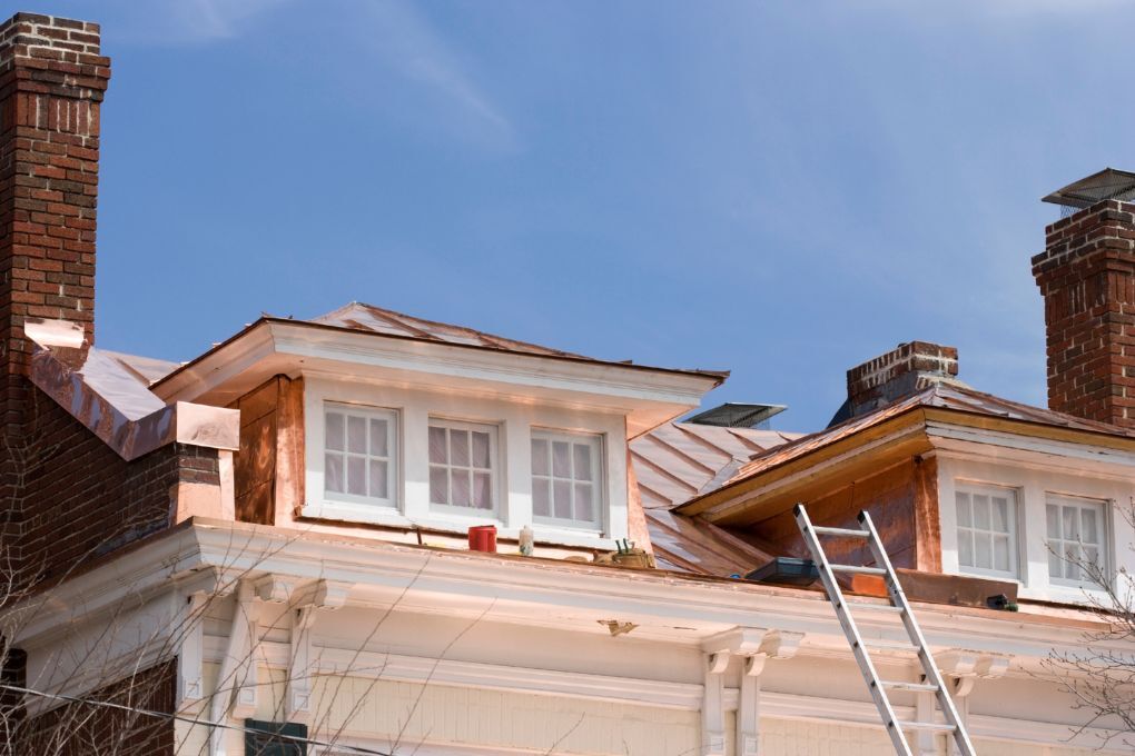 Roofers Kilmarnock repairing the roof around a dormer window